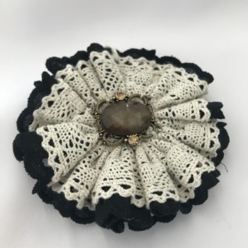 Black and cream lace brooch with gold embellishment by Christine Kolinsky